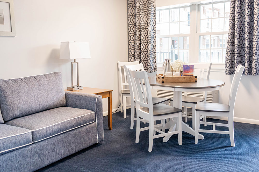 Pull-out couch and dining table with four chairs